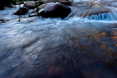 Blurred motion of rocks on sea shore