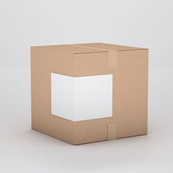 Close-up of paper box over white background