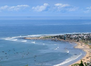 Scenic view of sea against blue sky