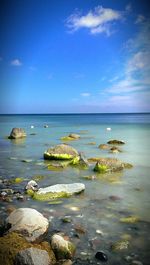 Scenic view of sea against cloudy sky