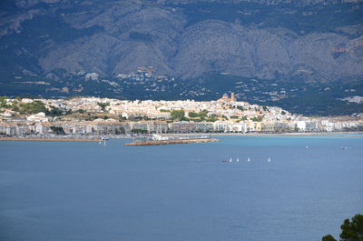 High angle view of townscape by sea