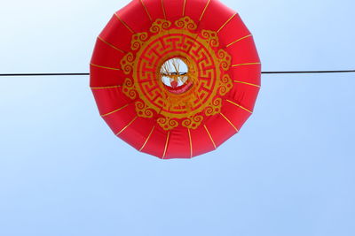 Low angle view of lantern hanging against clear sky