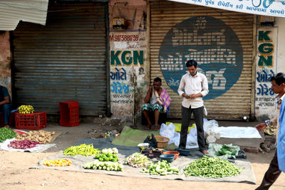 People standing at market stall
