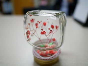 Close-up of glass jar on table