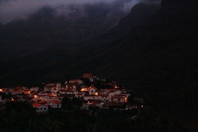 High angle view of town against sky at night