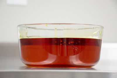 Close-up of beer glass against white background