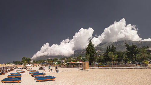 People on beach against sky