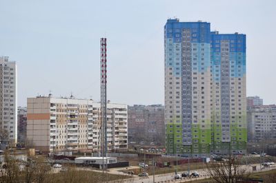 Modern buildings against sky in city