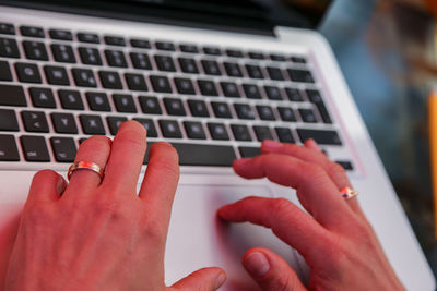 Close-up of hands using mobile phone