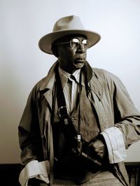 Portrait of man wearing hat against white background