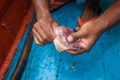 High angle view of hands working