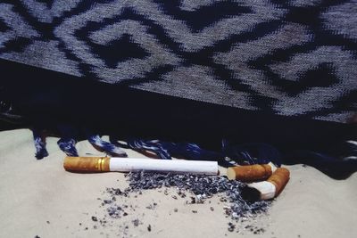 High angle view of cigarette on table