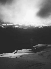 Scenic view of snow covered mountains against sky