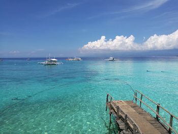 Boats moored in sea