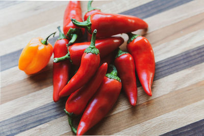 Close-up of red chili peppers on table