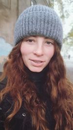 Portrait of smiling young woman in winter