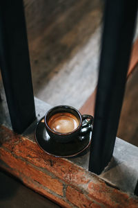 High angle view of black coffee on table