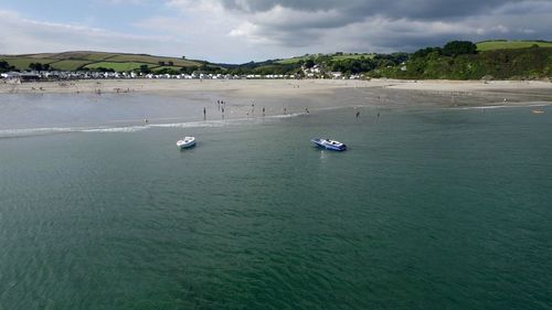 High angle view of boats in sea against sky