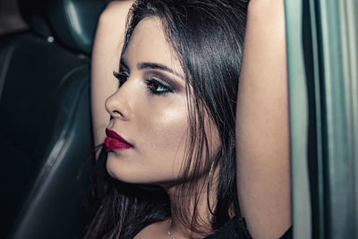 Portrait of beautiful woman in car