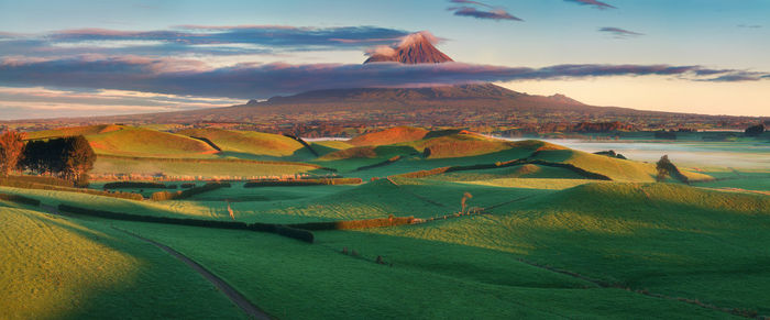 Scenic view of landscape against sky during sunset