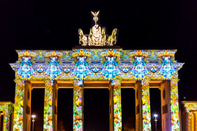 Low angle view of illuminated statue at night