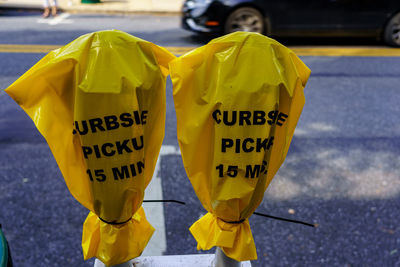 Close-up of yellow text on road in city