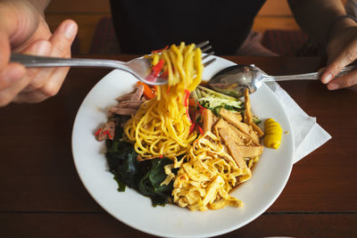 Cropped hand of person having food