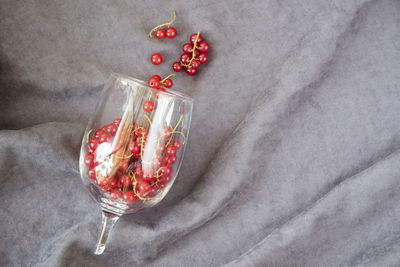 High angle view of cherries on glass