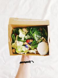 High angle view of hand holding food