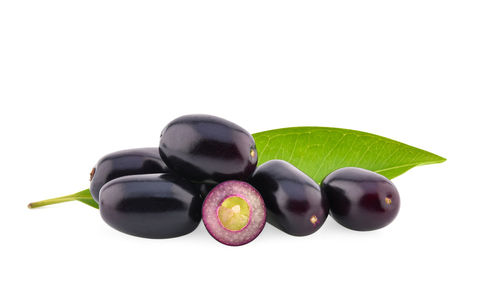 Close-up of fruits against white background