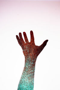 Close-up of human hand against white background