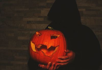 View of red pumpkin on table during halloween