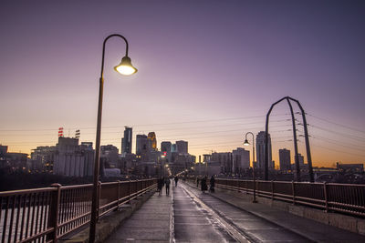 View of city lit up at dusk
