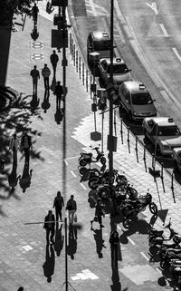 High angle view of people walking on road