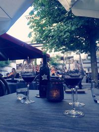 Close-up of wine glasses on table in restaurant