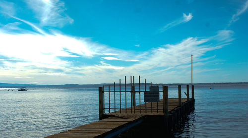 Pier on sea against sky