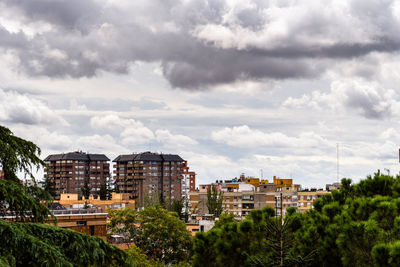 Buildings in city against sky