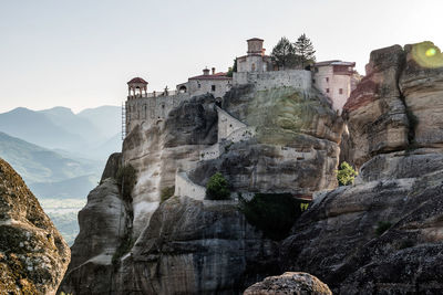 Low angle view of buildings against mountain