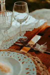 Close-up of wine glasses on table