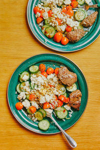 Healthy homemade lunch of greek salad and steak in camper van.