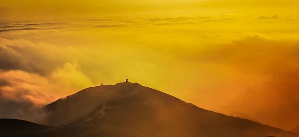 Scenic view of silhouette mountain against sky during sunset