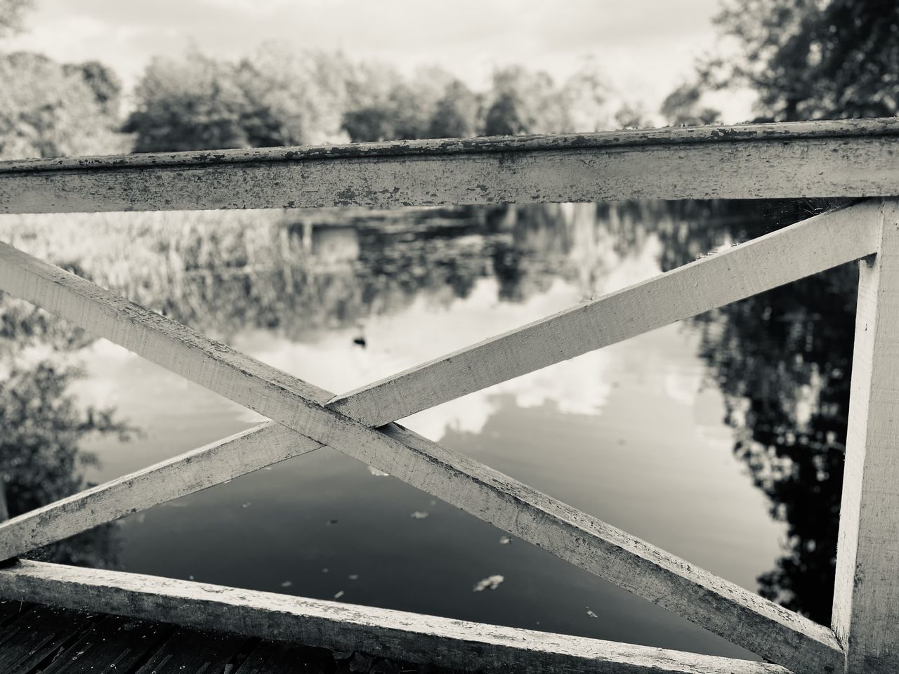 CLOSE-UP OF BRIDGE OVER LAKE