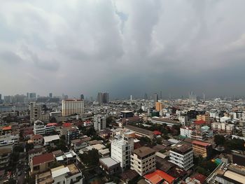 High angle view of city buildings against sky