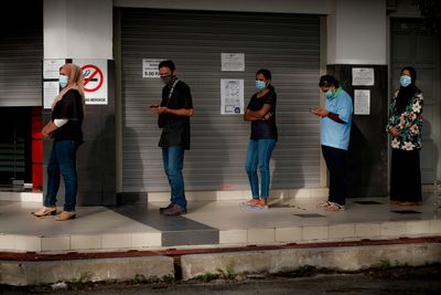 People standing against wall