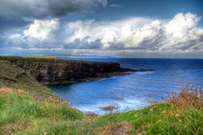 View of calm sea against cloudy sky