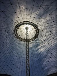 Low angle view of ferris wheel against sky