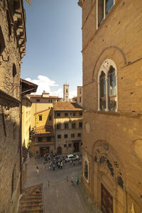 Buildings in city against sky