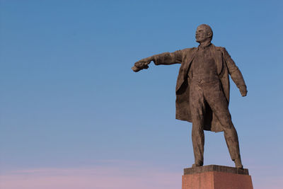 Low angle view of statue against clear blue sky