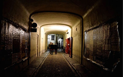 Rear view of woman walking in corridor