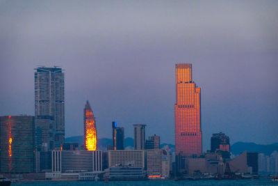 Buildings in city at dusk